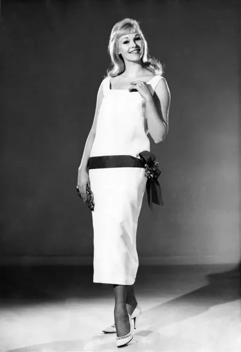 Framed Print : Reveille Fashions 1964: Jo Waring modeling a summer dress with belted detail