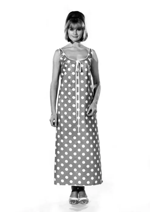 Framed Print : Reveille Fashions 1964: Margaret Larraine modeling a full length night dress with large Framed Print : Reveille Fashions 1964: Margaret Larraine modeling a full length night dress with large