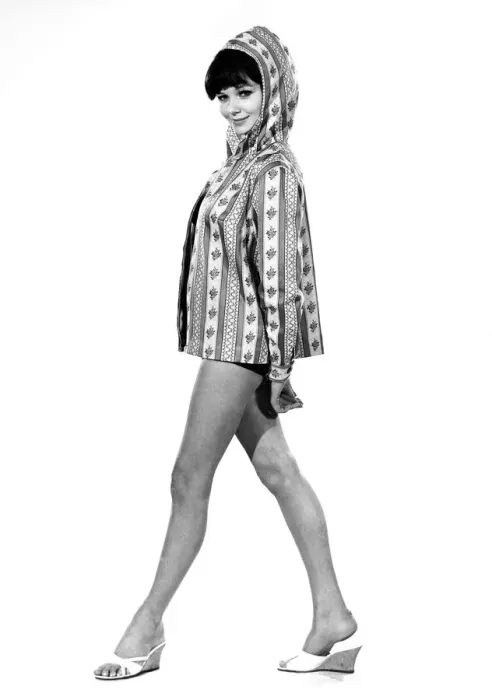 Framed Print : Reveille Fashions 1964: Meriel Weston modeling a hooded beach jacket. April 1964 P007619