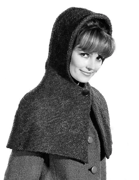 Reveille Fashions 1964: Vivienne Cornwall medelling a hooded shawl. December 1964 P007581