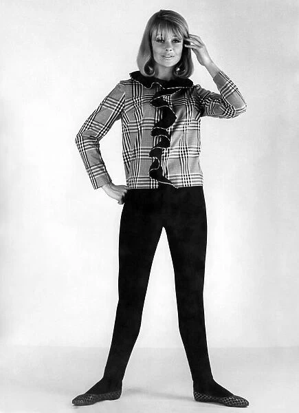 Reveille Fashions 1966: Marilyn Rickards modelling frilly blouse and slacks