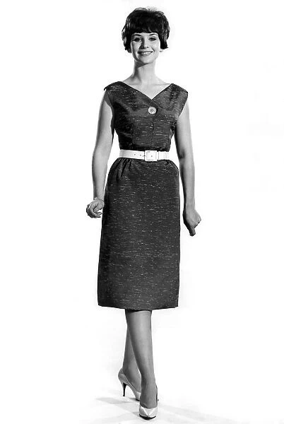 Reveille Fashions: Ann Cave modeling a summer dress with white belt detail