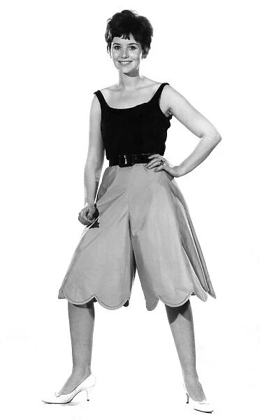 Reveille Fashions. Ann Cave models vest top and baggy shorts. August 1962 P011086