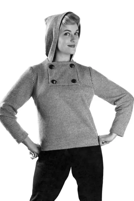 Framed Print : Reveille Fashions: Button up the cold, model wearing hooded jumper. January 1959 P006939 Framed Print : Reveille Fashions: Button up the cold, model wearing hooded jumper. January 1959 P006939