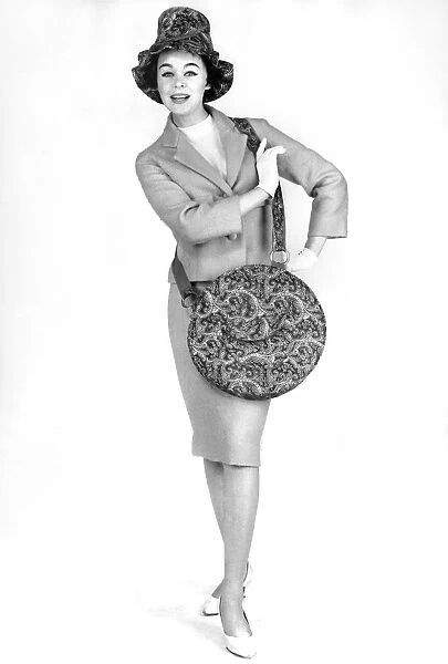 Reveille Fashions: Jackie Jackson modelling matching paisley pattern hat and handbag