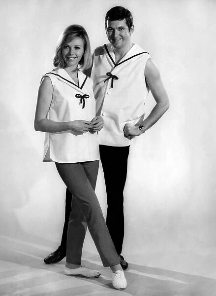 Reveille Fashions: Jill Carter, Mike Lester wearing sailor style fashion tops design to