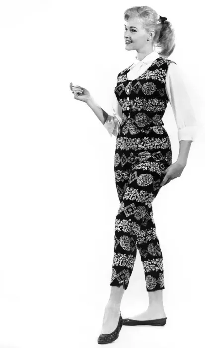 Framed Print : Reveille fashions: Jo Waring wearing a matching patterned slacks and top Framed Print : Reveille fashions: Jo Waring wearing a matching patterned slacks and top