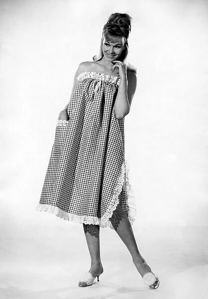 Reveille Fashions: Jo Waring. wearing a three quarters length night dress