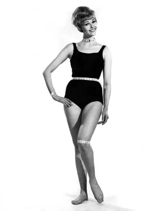 Framed Print : Reveille Fashions. Mannequin modeling a one piece swimming costume with a tape measure Framed Print : Reveille Fashions. Mannequin modeling a one piece swimming costume with a tape measure