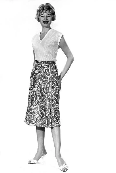 Reveille Fashions. Margaret Lorraine modelling a knee length paisley pattern skirt