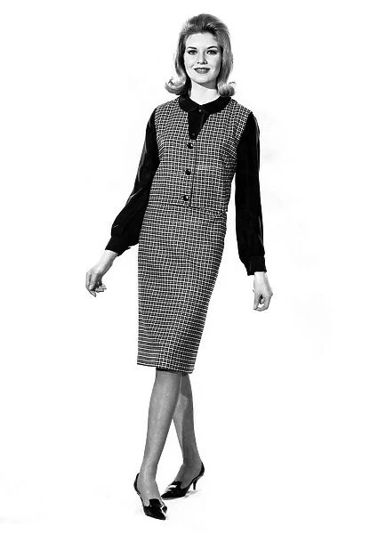 Reveille Fashions: Maureen Walker modeling a check pattern twin set