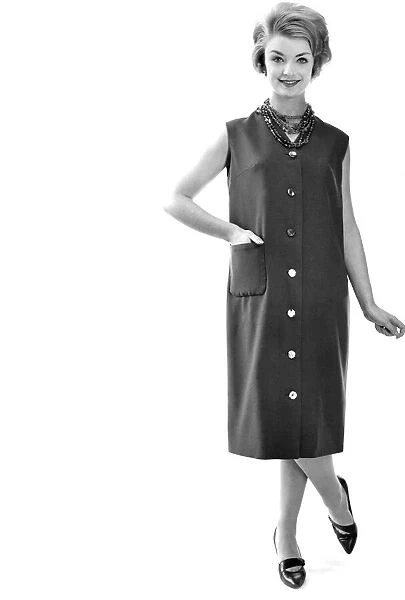 Reveille Fashions: Model wearing sleeveless summer dress. March 1959 P006927