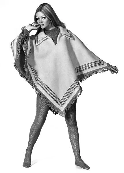 Reveille Fashions: Penny Dennis wearing a poncho. October 1969 P008474