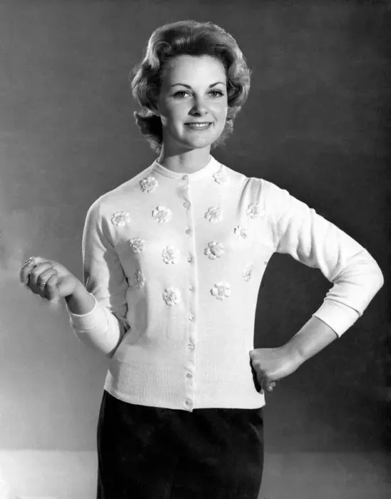 Framed Print : Reveille Fashions. Roma Reeves modeling a cardigan with embroided flower detail Framed Print : Reveille Fashions. Roma Reeves modeling a cardigan with embroided flower detail