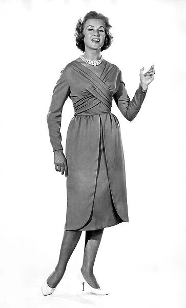 Reveille Fashions: Rosemary Steward modelling the latest 1959 design cocktail dress