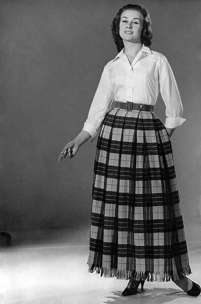 Reveille Fashions: Rosemary Stewart wearing a full length tartan skirt