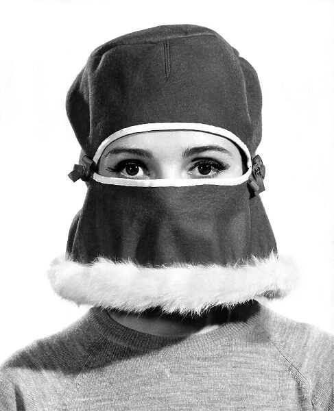 Reveille Fashions: Vivienne Cornwall weaing fur trimmed veil. December 1964 P007531