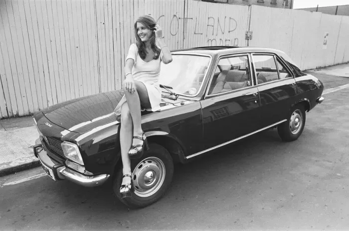 Framed Print : Reveille model Beulah Hughes seen here posing with a Peugeot 504 car which is a top prize