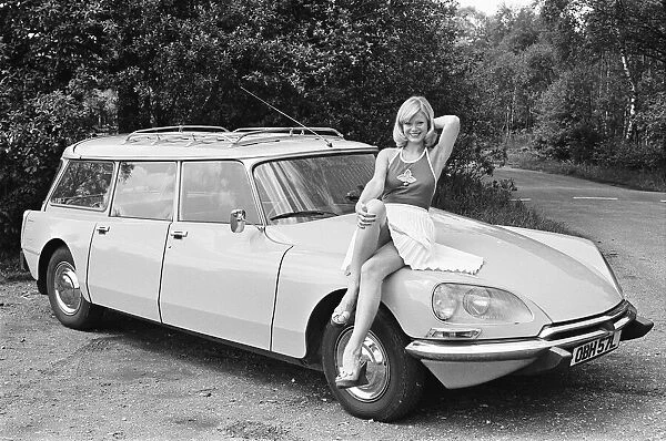 Reveille model Jan Burdette seen here posing with a Citroen DS car which is a top prize