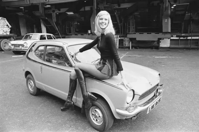 Framed Print : Reveille model Krista seen here posing with a Honda Civic car which is a top prize in Framed Print : Reveille model Krista seen here posing with a Honda Civic car which is a top prize in