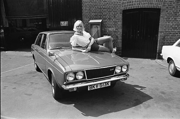 Reveille model Nancy Lee seen here posing with a Hillman Sunbeam which is top prize in