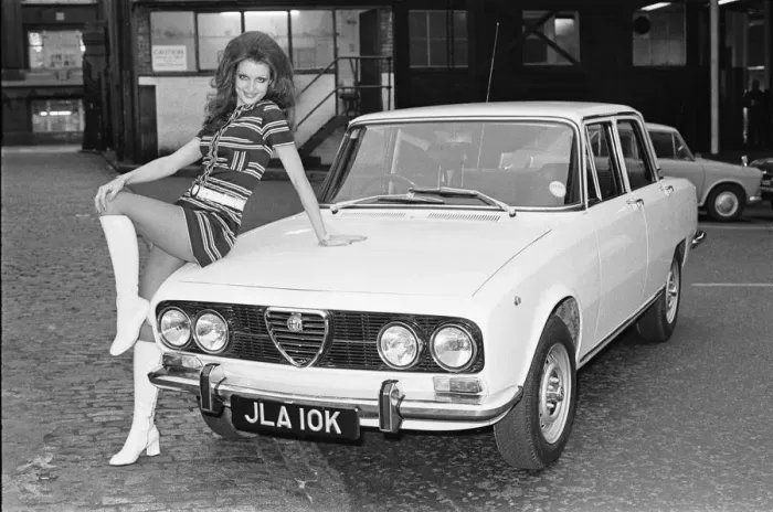 Framed Print : Reveille model seen here posing with a Alfa Romero car which is top prize in the Reveille Framed Print : Reveille model seen here posing with a Alfa Romero car which is top prize in the Reveille