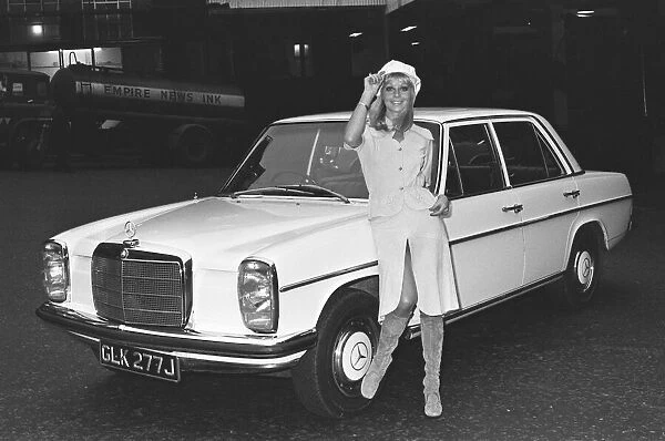 Reveille model seen here posing with a Mercedes Benz car which is top prize in