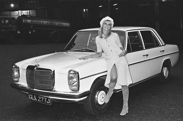 Reveille model seen here posing with a Mercedes Benz car which is top prize in