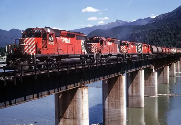 Framed Print : Revelstoke British Columbia Canada Freight train pulled by four diesel engines