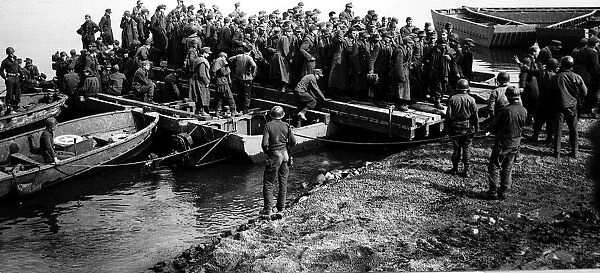 Rhine crossing of Us third army barge discharging german prisoners after crossing