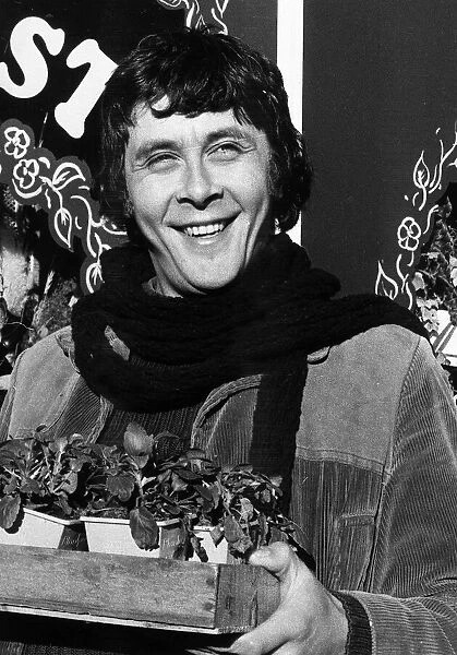 Richard Beckinsale actor with pot plants 1979