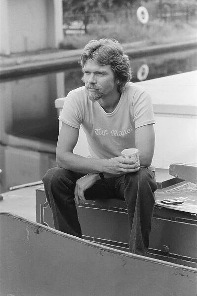 Richard Branson, 28 year old mastermind behind Virgin Music company. Relaxing on his boat