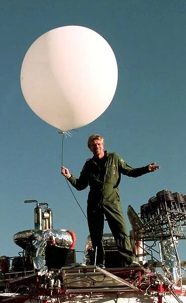 Richard Branson on top of his Balloon capsule December 1997 with a small weather test