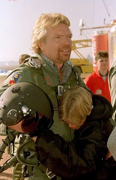 Richard Branson about to board the Virgin Global Challenger balloon is hugged by son Sam