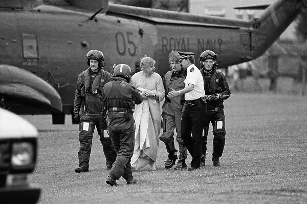 Richard Branson pictured centre walking with the policeman