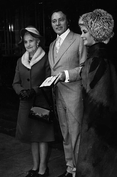 Richard Burton with his CBE insignia at the Palace in 1970 with Elizabeth