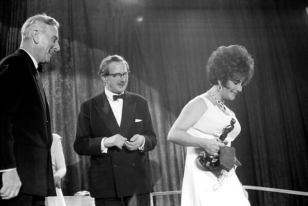 Richard Burton and Elizabeth Taylor seen here receiving awards from Lord Mountbatten
