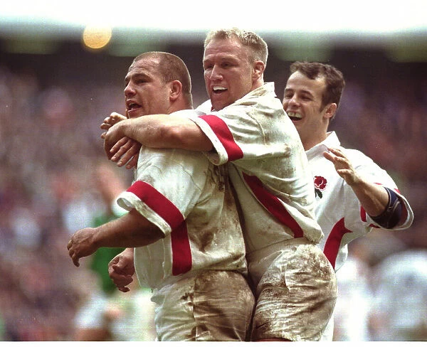 Richard Cockerill is congratulated after scoring for England by Neil Back