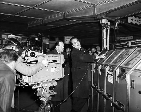 Richard Dimbleby filming for French television at Victoria Station. 9th March 1956