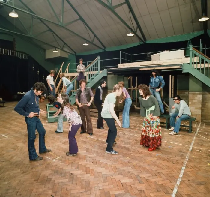 Framed Print : Richard Gere as Danny Zuko (left) seen here in rehearsal with the rest of the cast of
