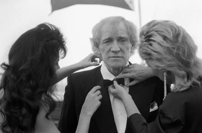 Framed Print : Richard Harris being dressed in black tie on the set of Maigret - March 1988 Framed Print : Richard Harris being dressed in black tie on the set of Maigret - March 1988