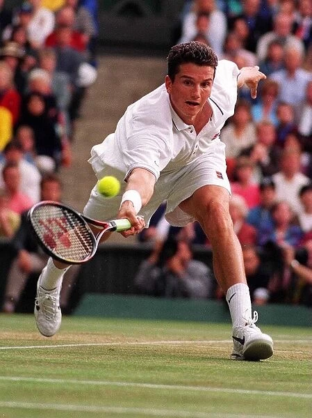 Richard Krajicek stretches for the ball against MaliVai Washington in the mens final at