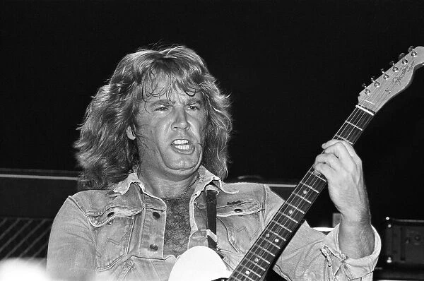 Rick Parfitt of rock group Status Quo, in concert in Vienna, Austria. 8th May 1986