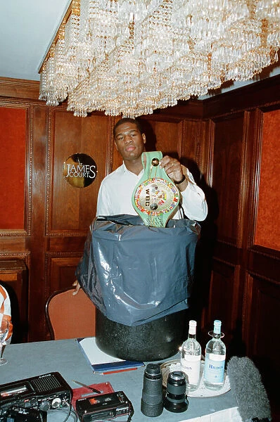Riddick Bowe Boxer The Undisputed World Heavyweight Championship Puts His WBC Belt Into