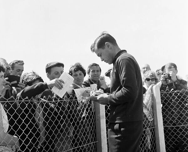Rider Gary Hocking signs autographs for fans. 4th June 1962