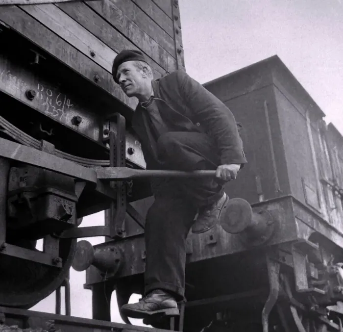 Framed Print : Riding the brake rods to slow down a string of free-moving trucks calls for good nerves Framed Print : Riding the brake rods to slow down a string of free-moving trucks calls for good nerves