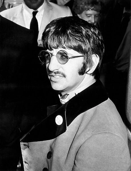 Ringo Starr drummer with the Beatles leaving hospital after his second child Jason was