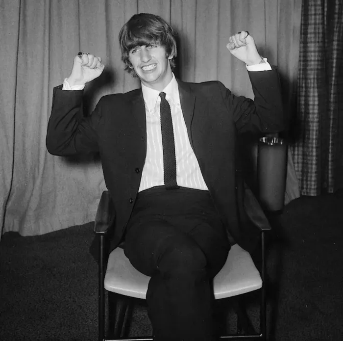 Framed Print : Ringo Starr sitting on chair arms raised February 1964 Framed Print : Ringo Starr sitting on chair arms raised February 1964