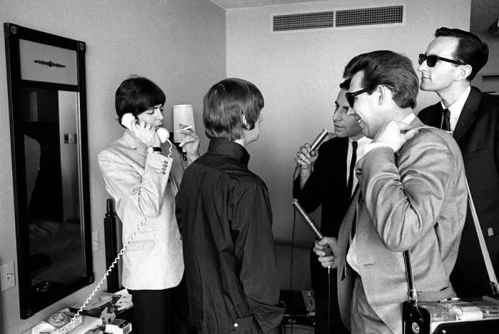 Framed Print : Ringo Starr talks to reporters and Paul McCartney talks on the phone August 1964 Framed Print : Ringo Starr talks to reporters and Paul McCartney talks on the phone August 1964