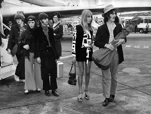 Ringo Starr with wife Maureen, and George Harrison with wife Pattie at Heathrow